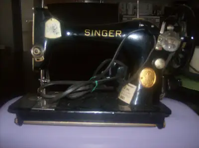 Machine à coudre Singer, View more