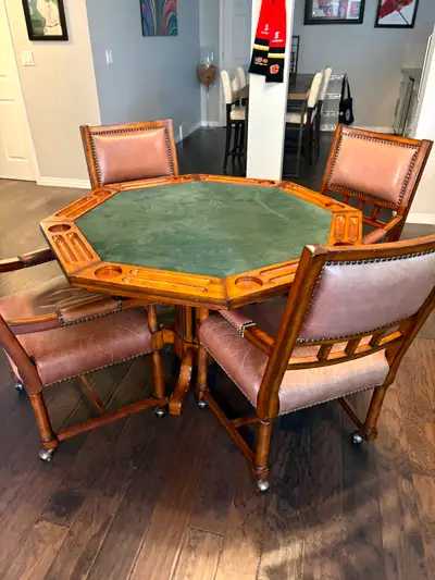 Beautiful poker table and 4 leather chairs, made by lazy- boy furniture, solid wood, great condition...