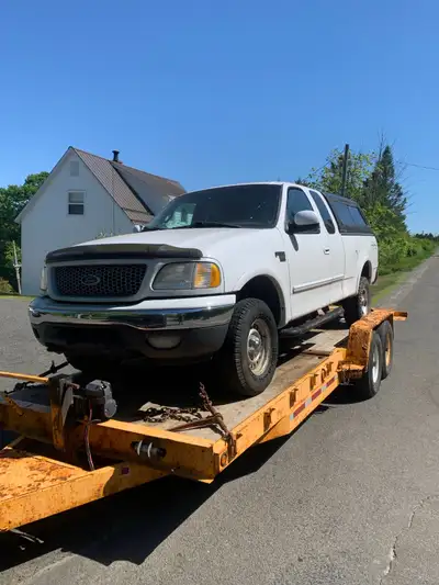 4.6 liter 4x4, truck starts, runs and drives but has a rough idle and exhaust leak. 4x4 works and tr...