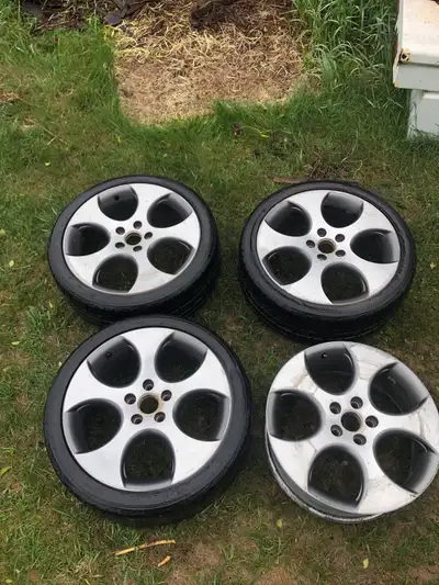 Four 18” rims. Three with tires. Bought for a project, never used. Cleaning up garage. Located by Do...