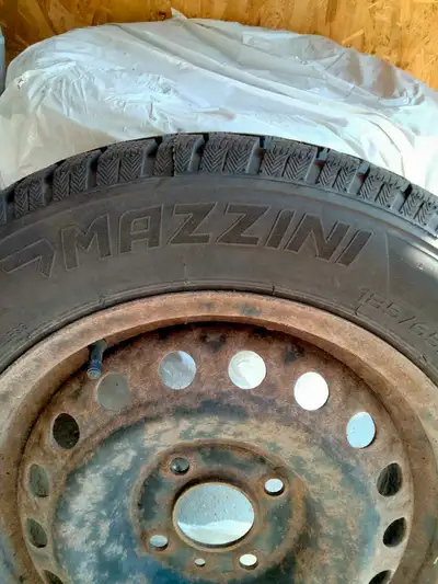 I'm selling a set of used Mazzini winter tires mounted on rims, size 185/65R15. These tires are stil...