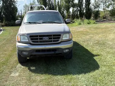 2003 F150. 4WD ,CC, AC,PS,PW,PL 407,000 km. Good running truck To many vehicles. Need to sell