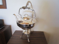 Silver plated antique teapot with stand