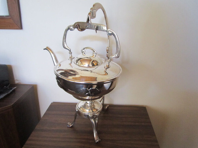 Silver plated antique teapot with stand in Arts & Collectibles in Nelson