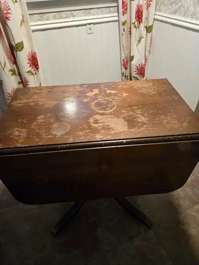 Antique table with drop down sides..needs refinishing