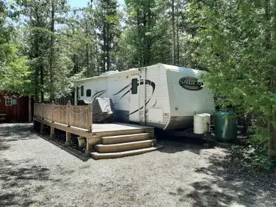 Well-maintained 2011 28-foot Forest River Salem trailer for sale at Mountain Trout Camp, which is lo...