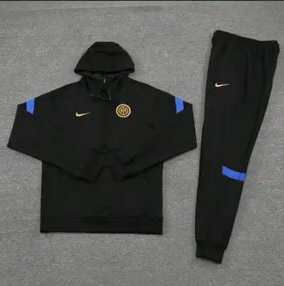 Hi. Folks. Brand new Inter Milan tracksuit half zip with tags. This set is an ultimate head turner....