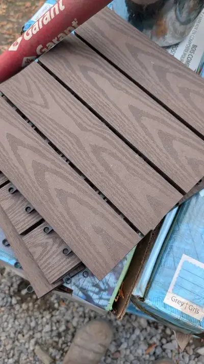 Goes for up to $10/sqft retail. Composite material like trex decking, colour is a med dark brown ('c...