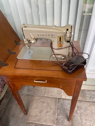 Vintage Singer sewing machine, View more
