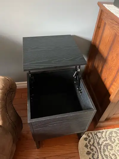 Black flip end table., View more