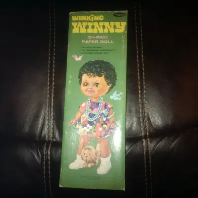 Winking Winny 9 1/2" paper doll with stand and 36 wardrobe piece, View more