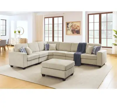 Great cream/ivory coored sectional sofa + ottoman. In boxes still, Needs to be assembled. Measurment...