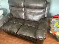 Faux leather reclining loveseat