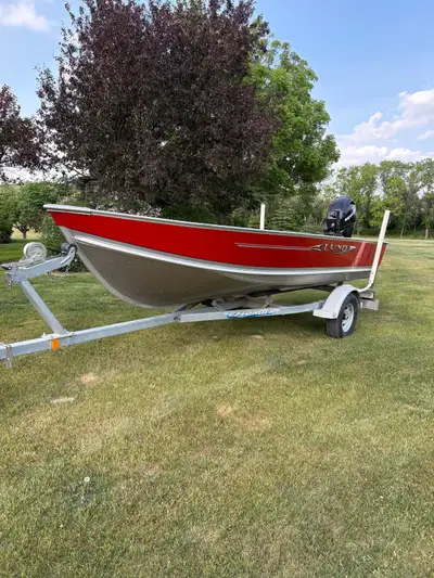 2010 Lund SSV 16 foot boat. 2010 EZ Loader 1750# axle up grade with oil bath hubs. 2011 Mercury 4 st...