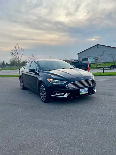 2017 Ford Fusion SE AWD 83,000 km Low-mileage Carfax proven Private sale. FRESH SAFETY Vehicle is cl...