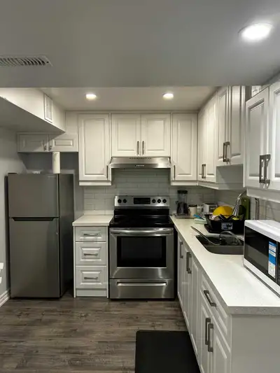 Cozy shared basement apartment available for rent, featuring a well-equipped kitchen with stainless...