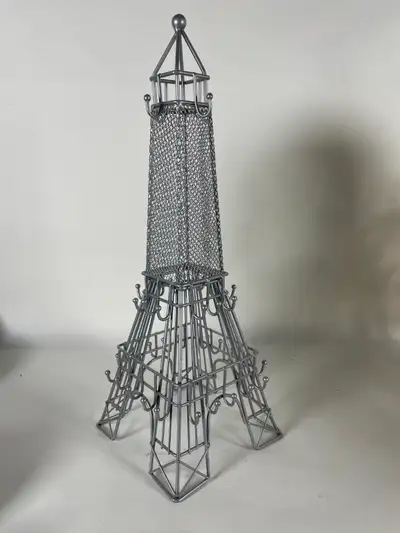 Add a touch of Parisian charm to your vanity or dresser with this beautiful silver-gray metal Eiffel...