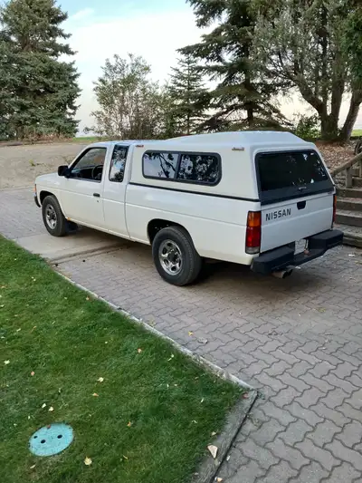 Truck Topper for older Nissan D21. $200 OBO.