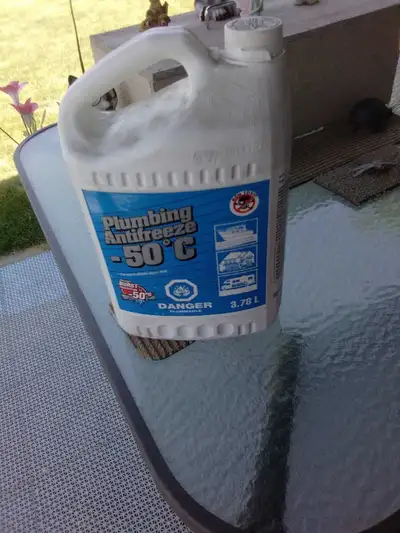 This is a used 3.78L jug of Plumbing Antifreeze -50°C, perfect for winterizing plumbing systems in b...