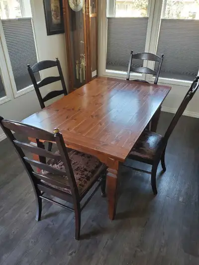 Selling a solid pine dining table with two extensions (15.75" each). Can seat up to 12 people. Also...