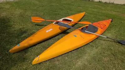 Selling a pair of kayaks with paddles. Both are 13 feet in length. The Sage is fiberglass (Made in E...