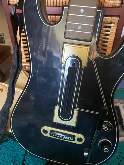 Rock on with this Guitar Hero guitar! This used controller is ready to plug and play, perfect for sh...