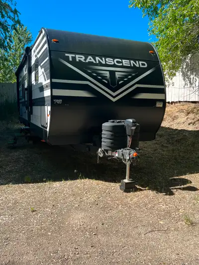 One year old. Used 4 times. Immaculate condition. 31", 1 slide, 6494 lbs, sleeps 7 Queen walk around...