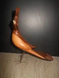 wooden bird with horn beck