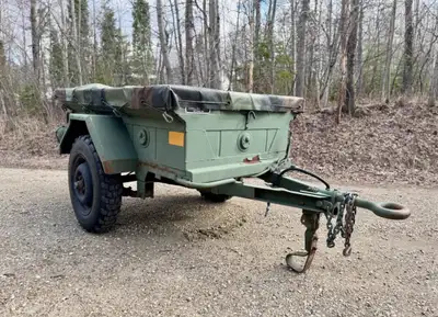 1974 1/4 ton cargo army trailer with heavy duty tarp. In great condition. Alberta registered.