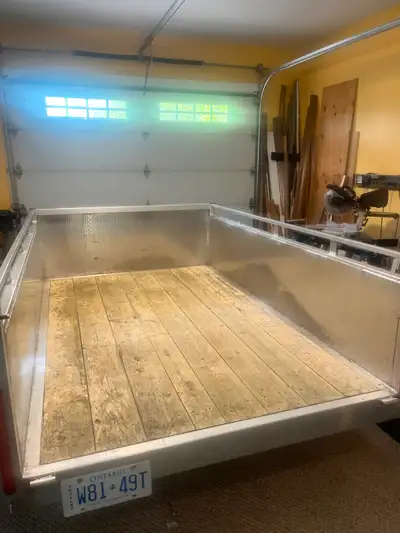 Aluminum trailer with aluminum storage box. 23 in. sides. LED waterproof lights. 5 Ft x 8 Ft. inside...