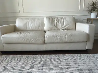 Used leather sofa. Seats very worn. Needs to be reupholstered.