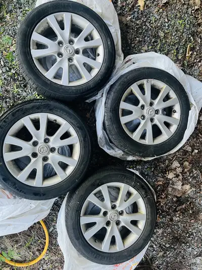 Mazda rims set in good shape for sale. Selling because when I bought the car it came with these rims...