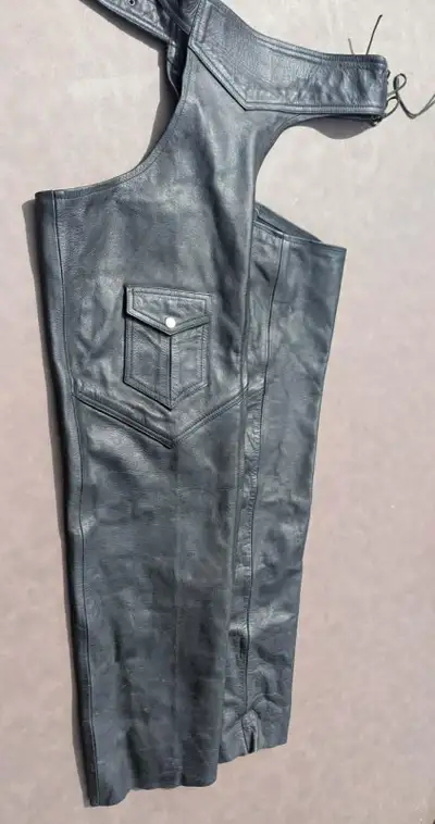 Two pair of vintage Roadgear leather motorcycle chaps. They are in good condition One pair Size: 32...