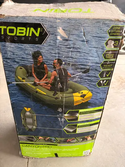 I'm offering a Tobin Sports Canyon Pro inflatable boat, perfect for leisurely paddles on calm waters...