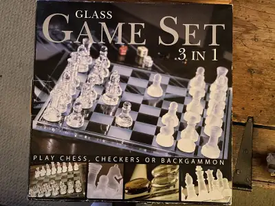 New in box, never used, three set glass set checkers, chess and backgammon games.