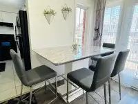 Marble dining table with bar stool chairs 