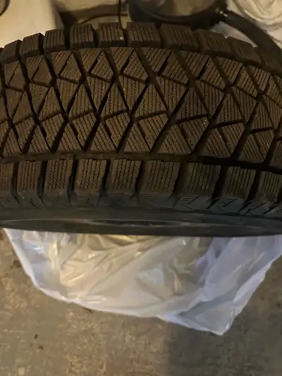Set of 4 winter tires with steel rims 2021 Tires were used on Toyota Highlander and Venza rims were...