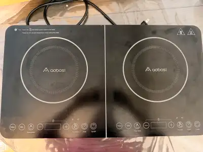 This Aobosi induction cooktop is a portable double burner with smart touch control and an LED displa...