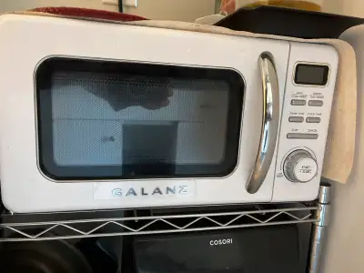 This Galanz microwave offers convenient cooking with its compact design and user-friendly controls....