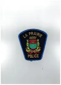 écusson de la défunte police de La Prairie (dissoute) au Québec