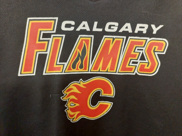 Licensed Calgary Flames NHL Apparel JerseyMintYouth XL$25 in Arts & Collectibles in Calgary - Image 2