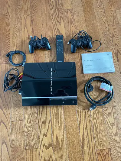 PlayStation 3 with manual, 2 controllers, remote and cables. Also plays BlueRay and DVD disks. Hardl...