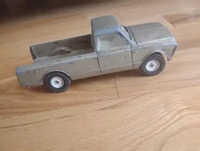 I have a vintage metal toy truck. 1960s. It has a broken windshield but a fun gold colour. Of course...