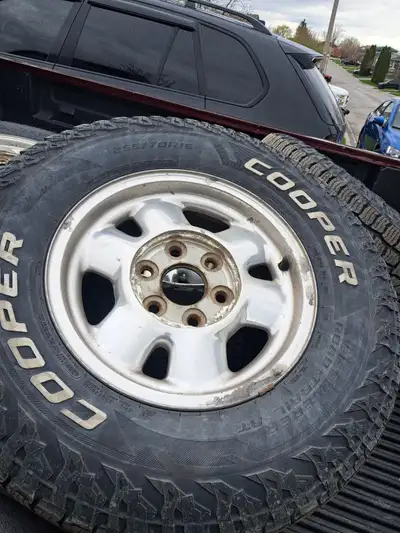 Full set of gmc sierra 6 bolts rims with center caps. Rims are decent. Also have 1 factory 16" gmc s...