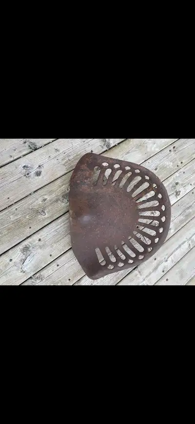I'm selling antique tractor seats with unique designs and rustic charm, perfect for collectors or ad...