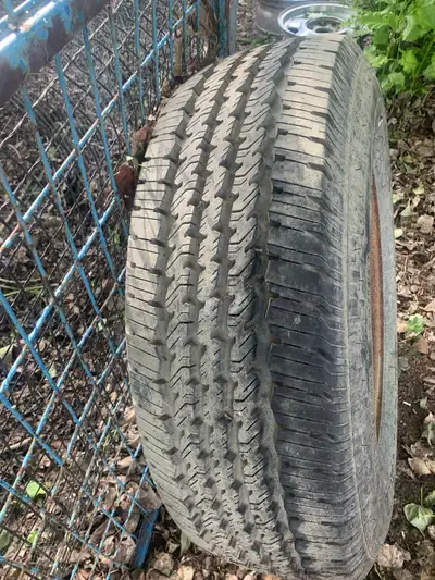 4 chev 8 stud 16” wheels and tires and 1 ford rim and tire new tire