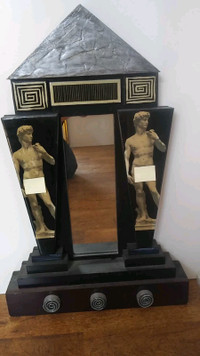 30 in by 20 in mirror on classical art piece with statues
