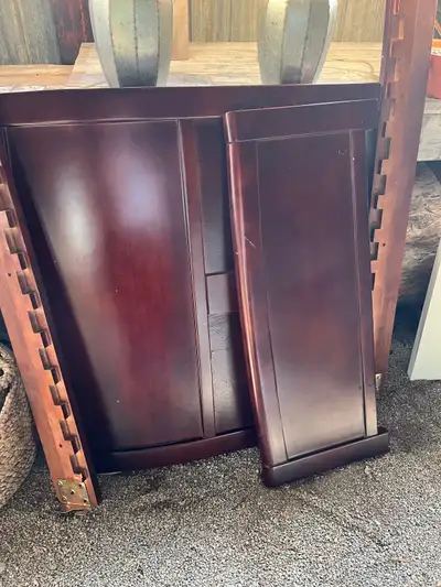 This is a used twin-sized bed frame with a rich, dark wood finish, perfect for a smaller bedroom or...