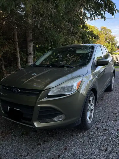 2014 Ford Escape – $3,800 Selling a 2014 Ford Escape in green with a gray interior. This SUV is reli...