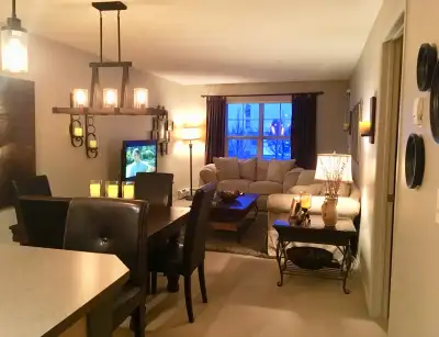 Beautiful and sparkling clean condo with a spacious, covered balcony with a gas BBQ overlooking a gr...